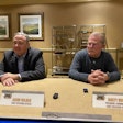 Jason Wilder, left, COO of Rush Enterprises, and Rusty Rush, president and CEO, talk to media in 2025.