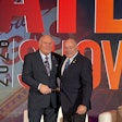 New ATD Chairman Kevin Holmes (left) takes the gavel from prior Chairman Scott Pearson during a general session at the 2026 ATD Show Thursday in Las Vegas.