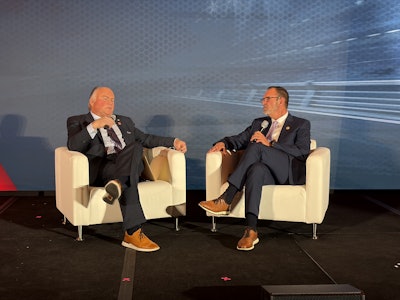 Incoming ATD Chairman Kevin Holmes (left) speaks with Terry Martin of Martin's Peterbilt after the latter was named the 2026 ATD Truck Dealer of the Year Thursday at the ATD Show in Las Vegas.