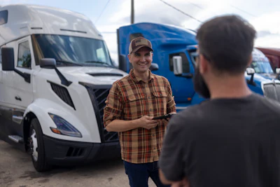 Drivers With Tablet By Trucks