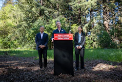 California Governor Gavin Newsom (center) announces the state's lawsuit against the Trump administration and the EPA over its repeal of the Endangerment Finding.