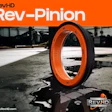 RevHD Rev-Pinion orange and black tire displayed on industrial concrete surface