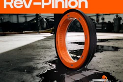 RevHD Rev-Pinion orange and black tire displayed on industrial concrete surface