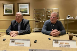 Jason Wilder, left, COO of Rush Enterprises, and Rusty Rush, president and CEO, talk to media in 2025.