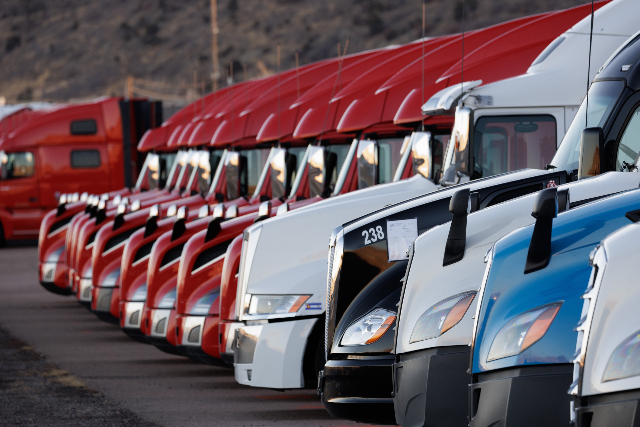 Row Of Red White And Blue Class 8 Trucks