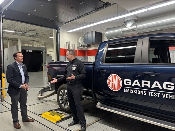EPA Deputy Administrator David Fotouhi, left, tours the Specialty Market Association facility in Michigan.