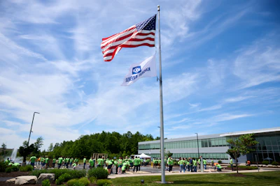 Employees from several departments helped frame a two-story home for an Ohio family at Bendix's Avon, Ohio, campus on June 1.