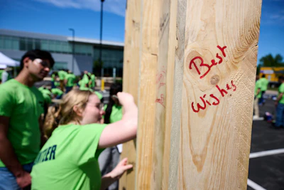 Employees wrote messages to the family on the framing as they built.