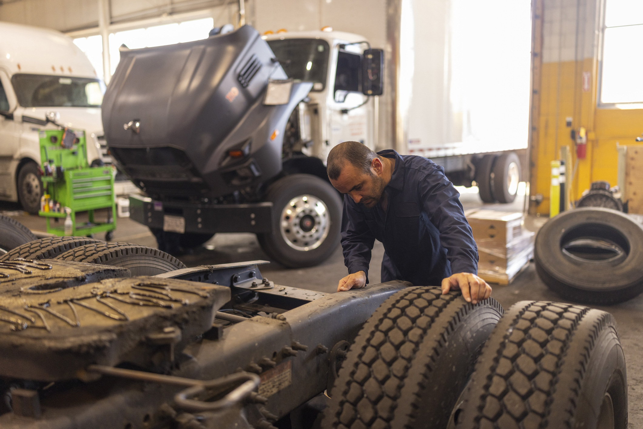 Technician Looking At Tires