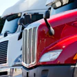 White And Red Trucks In A Lot