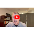 Man in striped shirt with YouTube play button logo overlay on face in home office setting