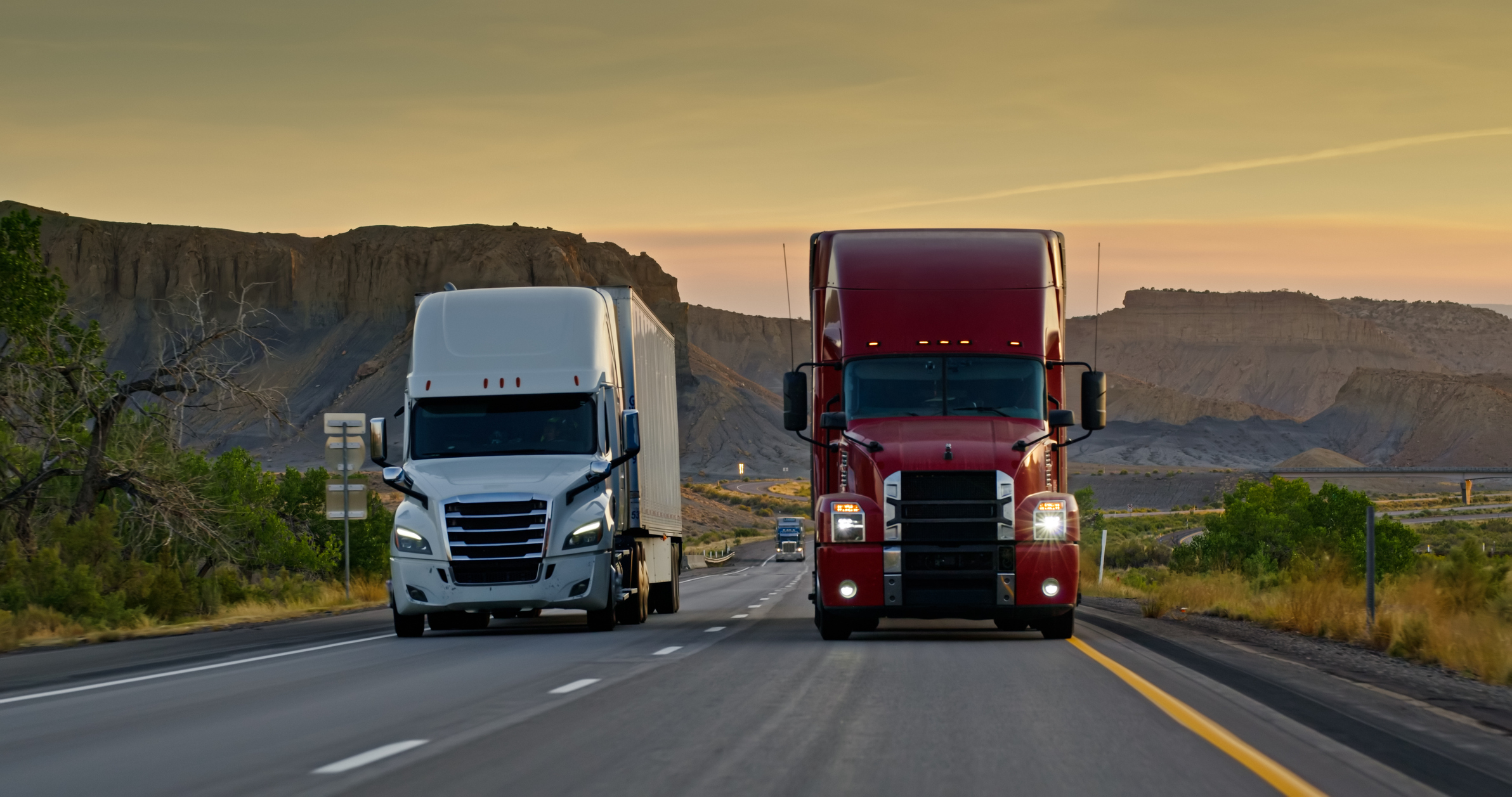 Two Trucks Driving Across Utah