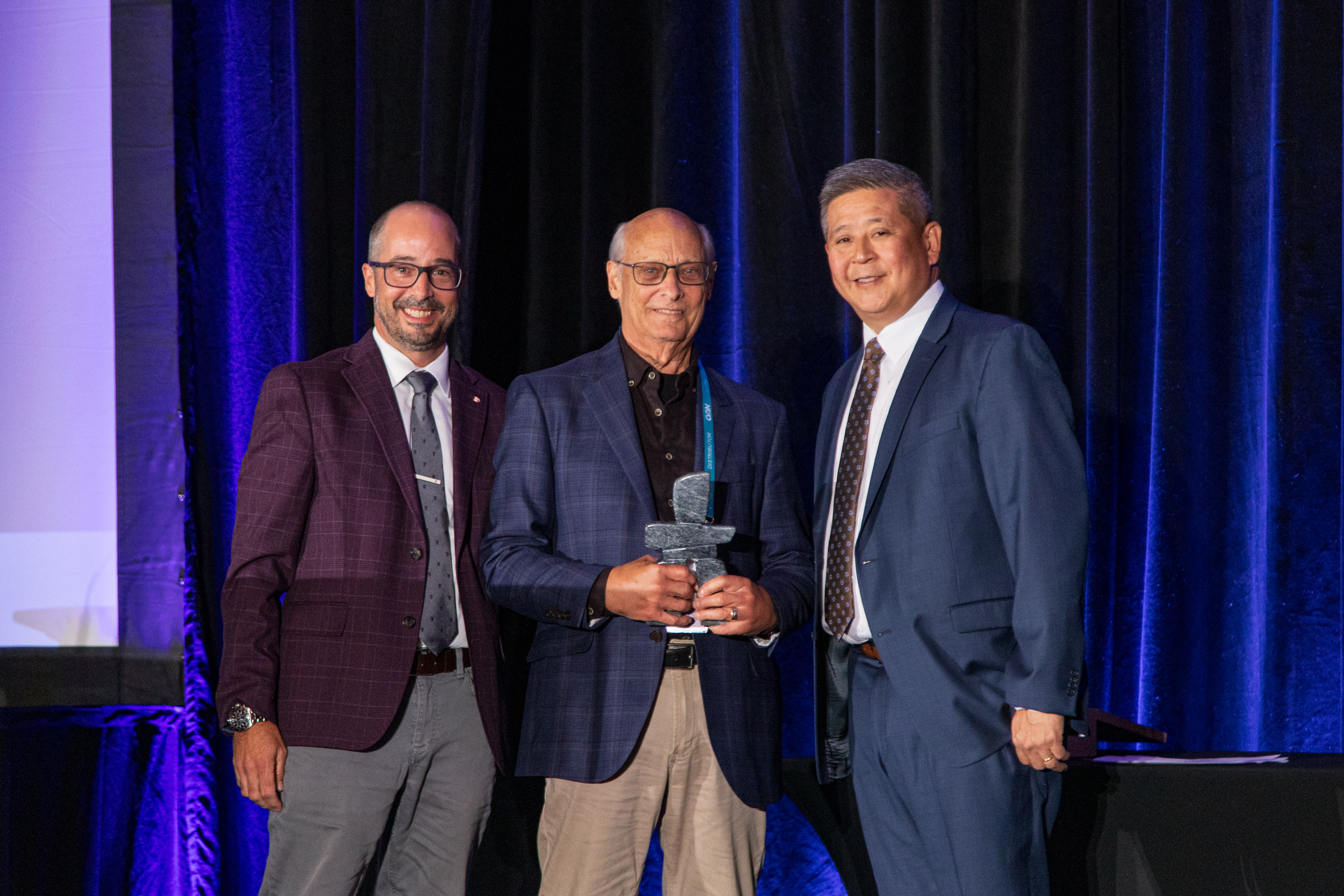 Jay Johnston (center), is presented the CVSN President's Award by Ian Johnston (left), Chairman of CVSN, and Edward Kuo (right) CVSN President at the CVSN Summit Friday in Montreal.