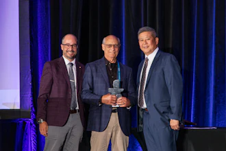 Jay Johnston (center), is presented the CVSN President's Award by Ian Johnston (left), Chairman of CVSN, and Edward Kuo (right) CVSN President at the CVSN Summit Friday in Montreal.