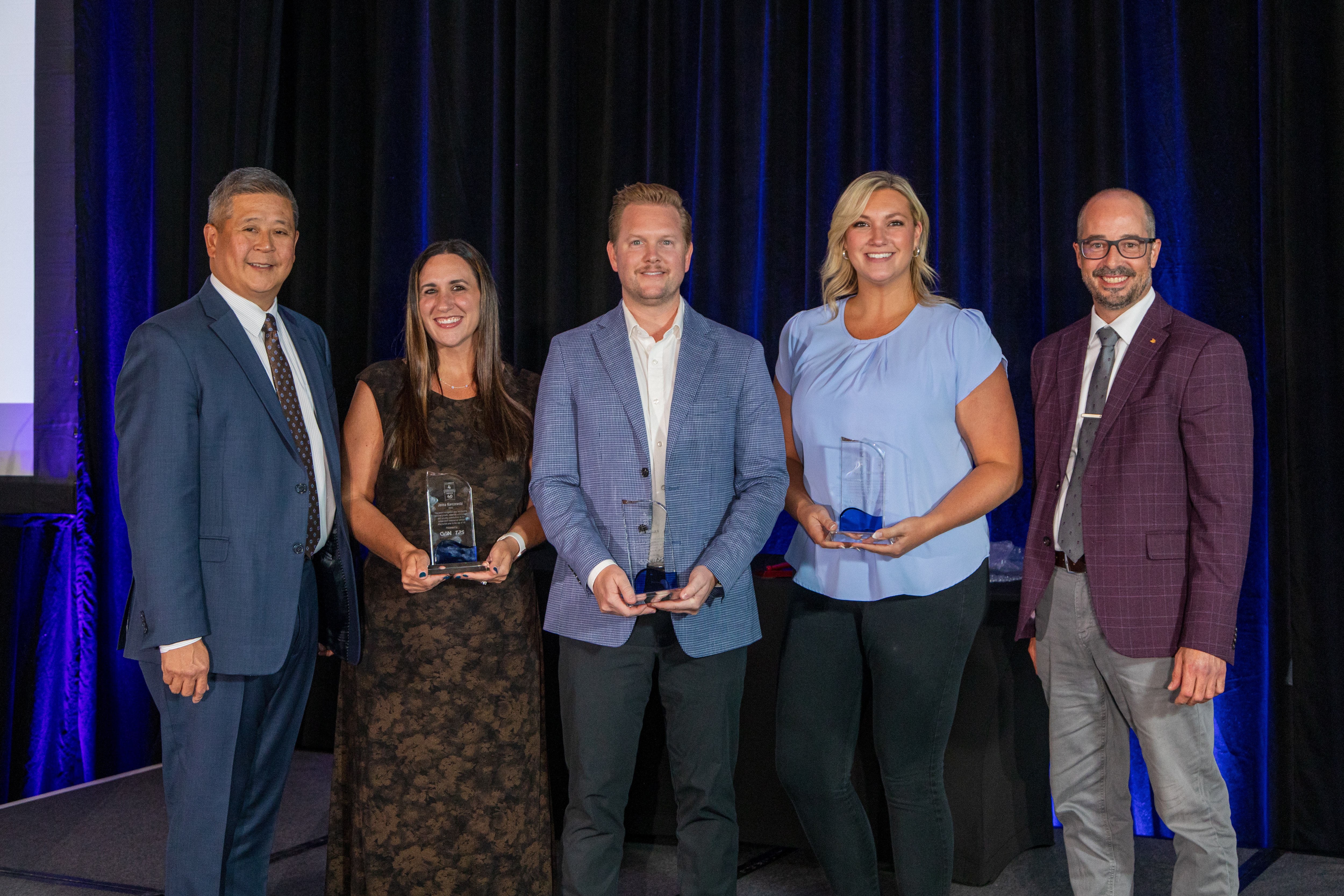 From left: CVSN President Edward Kuo, Jenna Karczewski of VIPAR Heavy Duty, Luke Masters of UAP, Paige Johnson of SKF, and Ian Johnston, CVSN Chairman recognize the GenNext 4 Under 40 Award winners Friday at the CVSN Summit in Montreal.