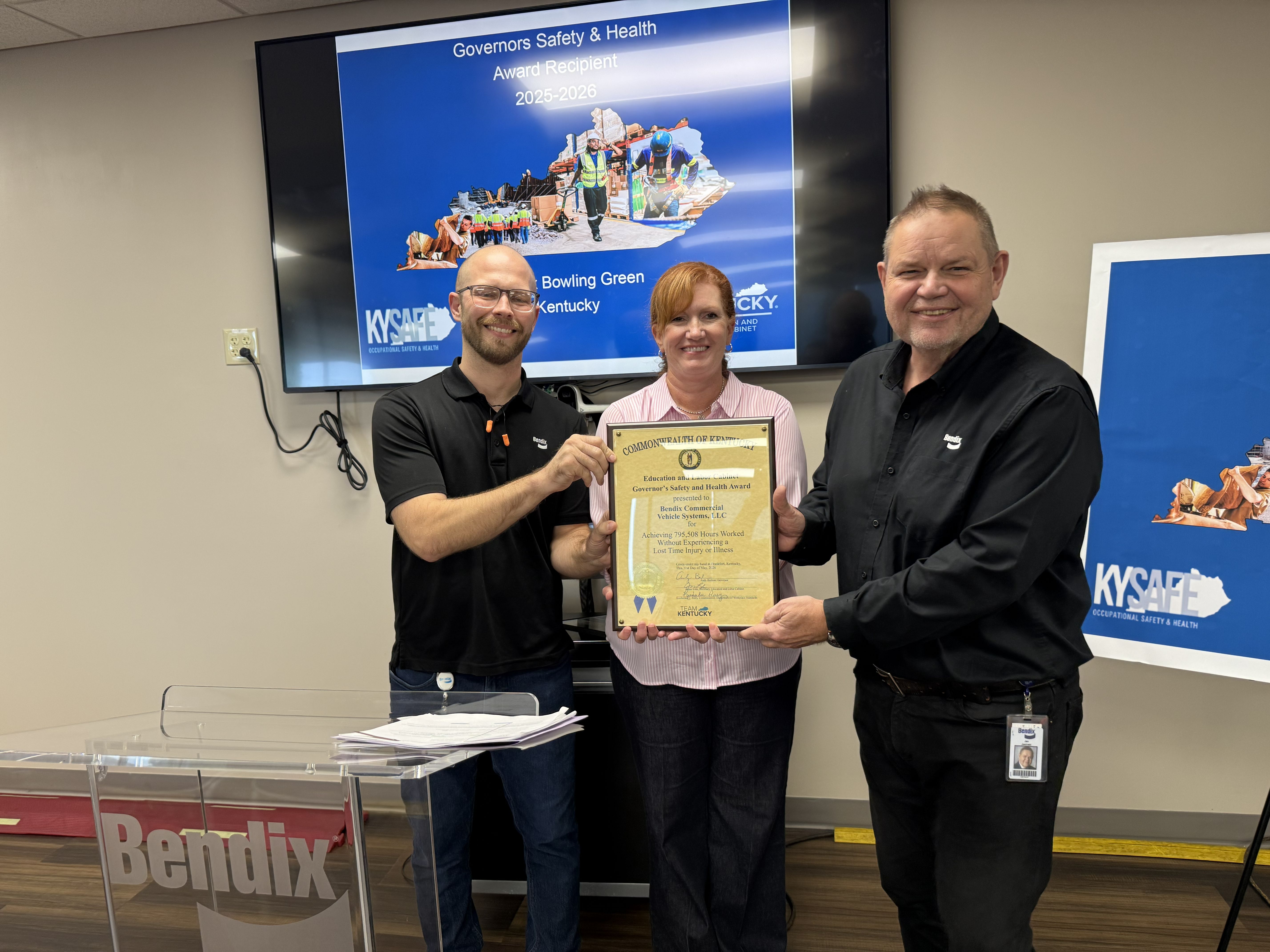 Caleb Denman, HSE manager at Bendix Bowling Green, at left, with Lynn Whitehouse, director of Kentucky Occupational Safety and Health Education and Training and Jan Jasinski, managing director of Bendix Bowling Green.