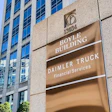 Boyle Building directory sign displaying Daimler Truck Financial Services on modern office building facade
