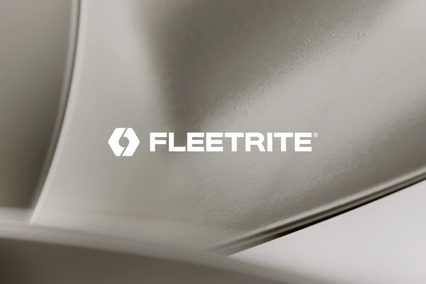 Fleetrite logo on metallic vehicle component surface