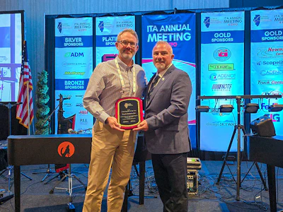 Eric Pettigrew is presented the Illinois Trucking Association Allied Member of the Year Award on behalf of Truck Centers Inc.