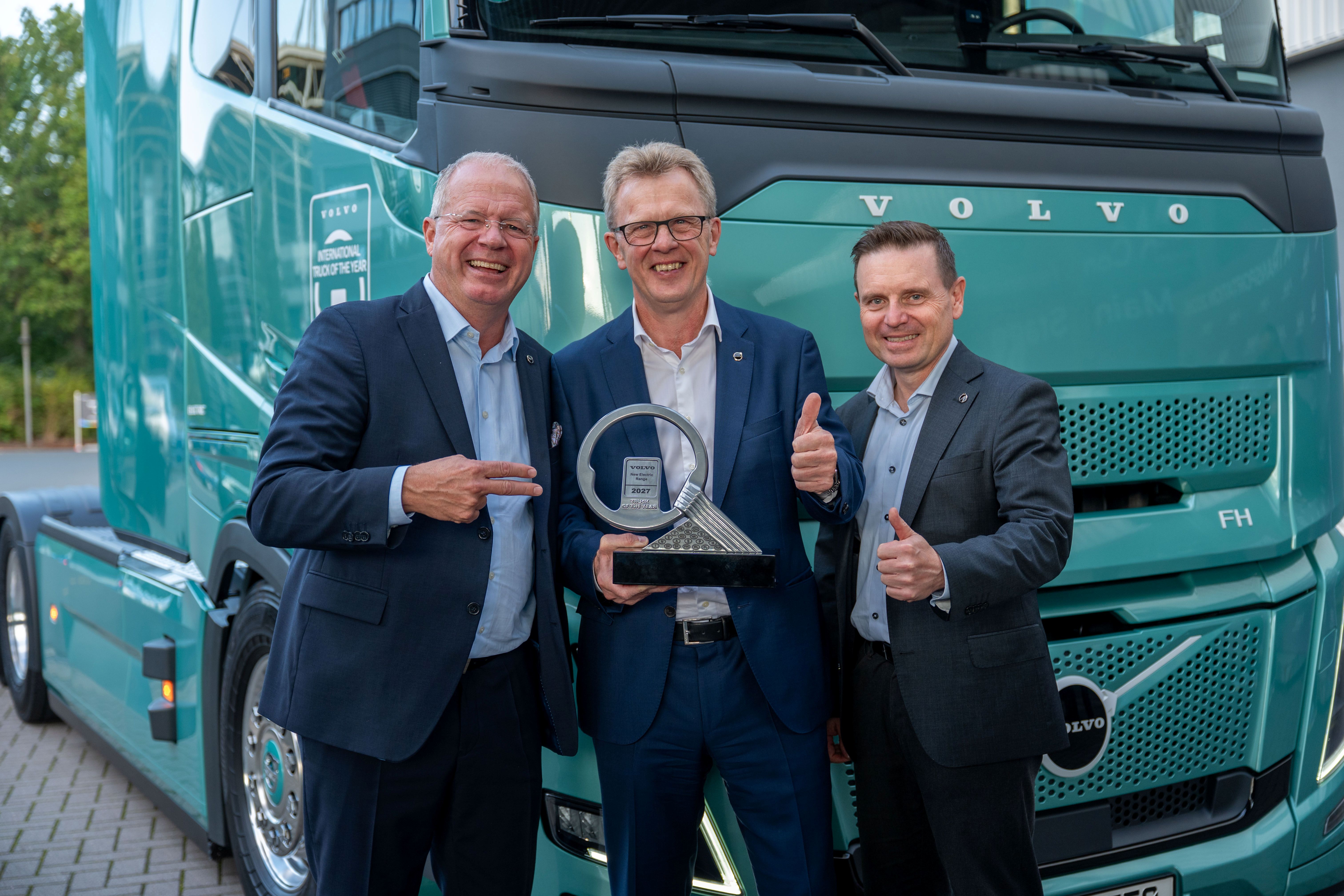 Martin Lundstedt, CEO and president of Volvo Group, shows off the International Truck of the Year Award with Roger Alm, center, executive vice president of Volvo Group and president of Volvo Trucks; and Jens Holtinger, CTO at Volvo Group and executive vice president of the Trucks Technology & Industrial division.