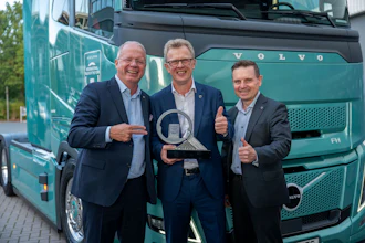 Martin Lundstedt, CEO and president of Volvo Group, shows off the International Truck of the Year Award with Roger Alm, center, executive vice president of Volvo Group and president of Volvo Trucks; and Jens Holtinger, CTO at Volvo Group and executive vice president of the Trucks Technology & Industrial division.