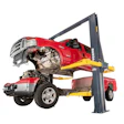 Two-post automotive lift holding damaged red pickup trucks in repair shop setting