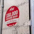 Red circular milestone badge on trailer reading '150,000 Milestone Trailer Built for Hurricane Express' from Wayne, Nebraska