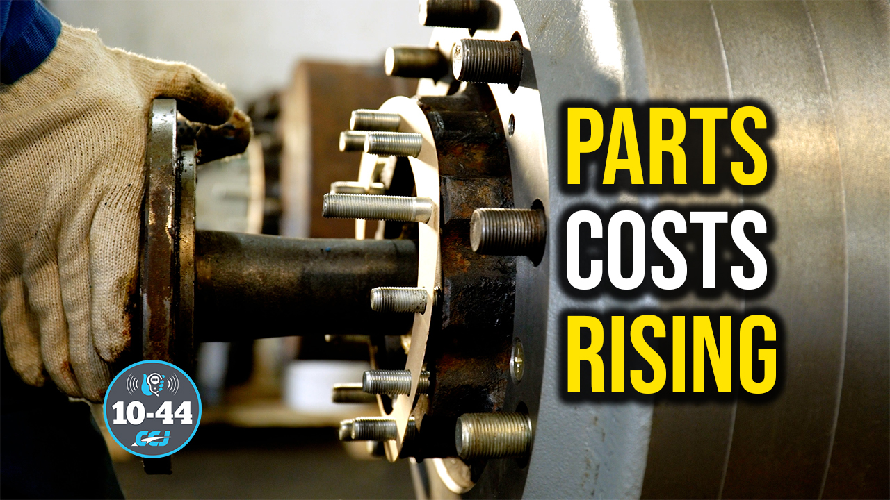 Mechanic holding industrial brake assembly with text overlay stating 'Parts Costs Rising'