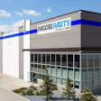PACCAR Parts modern warehouse facility with blue and white branding on gray industrial building exterior