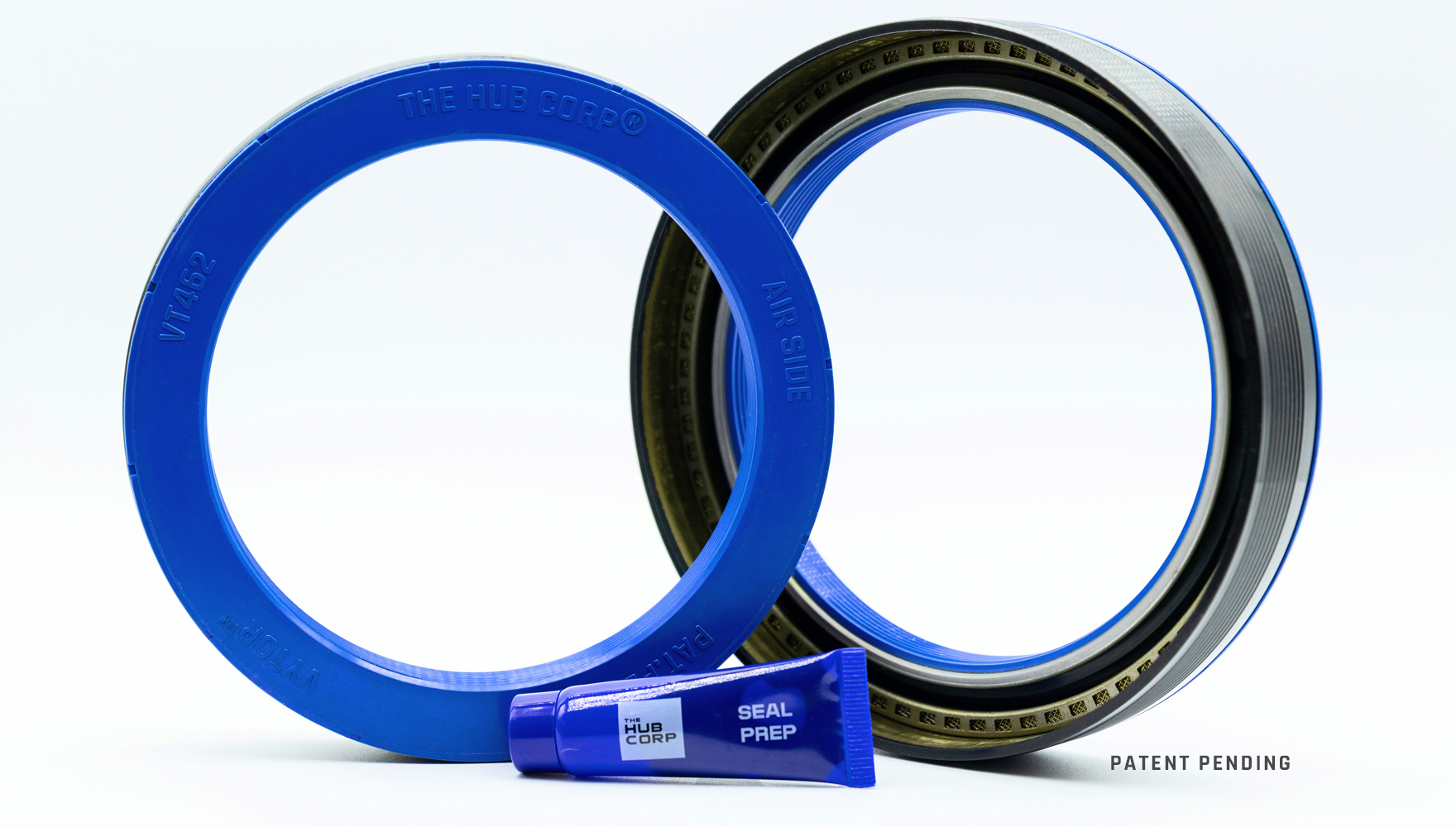 Blue and black industrial sealing rings with blue seal preparation label on white background