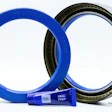 Blue and black industrial sealing rings with blue seal preparation label on white background